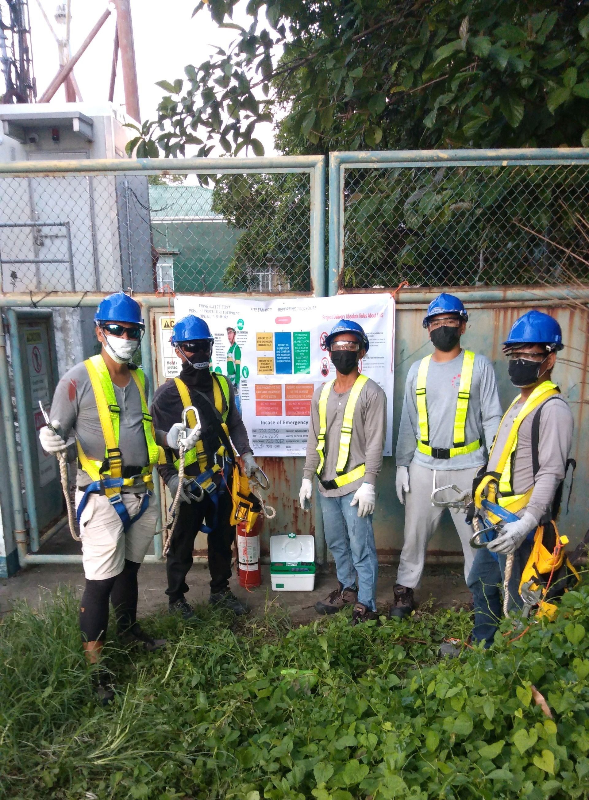 ECGM team members in safety gear at a project site